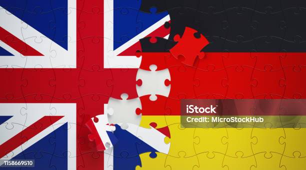 Jigsaw Puzzle Pieces Textured With German And United Kingdom Flags Stock Photo - Download Image Now