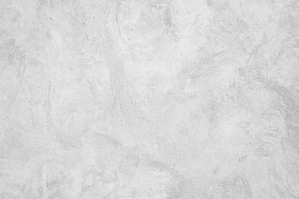 istock Grunge Cement Wall Paint Texture Background , Closeup Grunge Texture White Paint Concrete Wall architecture design background 1158670156