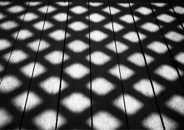 istock Square shadows on wooden floor background 1158671481