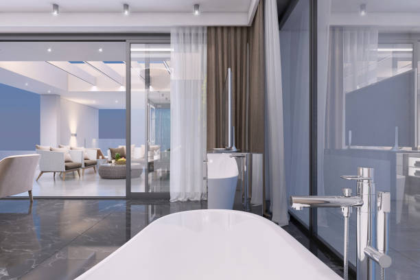 istock Luxury open plan bedroom interior with bathroom with glass wall 1158672694