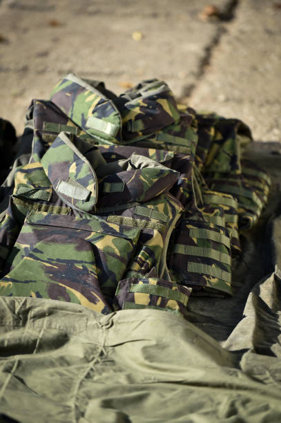istock Camouflage bullet proof vest in a shooting range zone 1158674118
