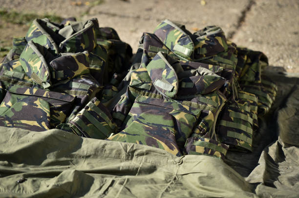 istock Camouflage bullet proof vest in a shooting range zone 1158674325