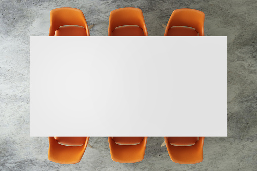 Top view of a large office desk table top with chairs around. Blank table top, copy space template mock up for designers. 3D render
