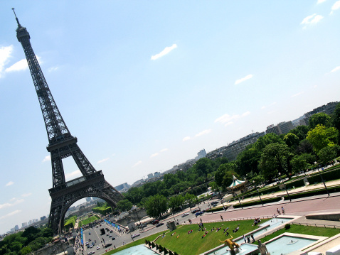 The Eiffel Tower in Paris among the spring green trees