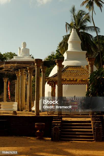 Ambasthala Dagoba And Buddha Statue In Mihintale Stock Photo - Download Image Now - Architectural Column, Asia, Buddha