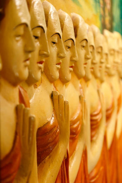 istock Row of Buddhist monks relief 1158676280