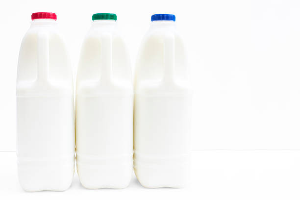 Three bottle of fresh milk on white with path stock photo