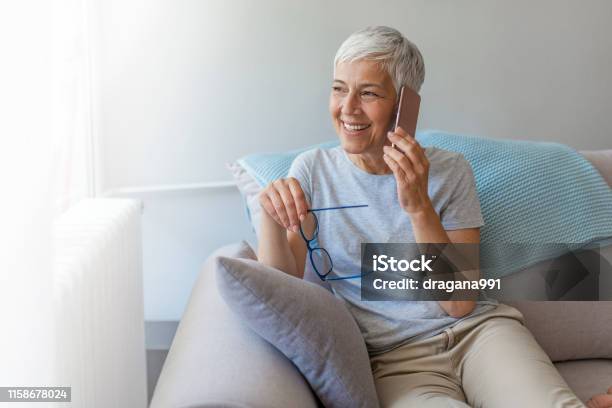 Senior Woman Talking On Her Mobile Phone Stock Photo - Download Image Now - Using Phone, Senior Adult, Women