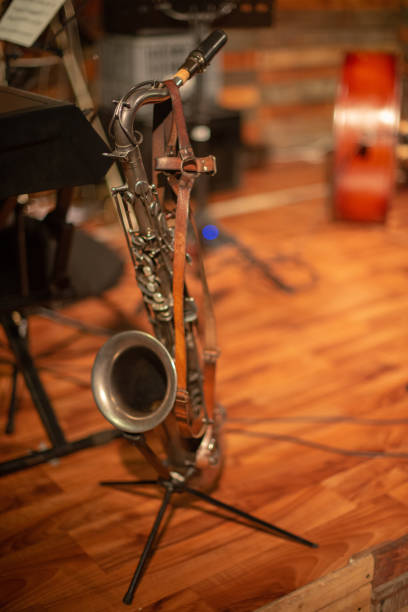 istock Saxophone in stand on stage during live music performance 1158679634