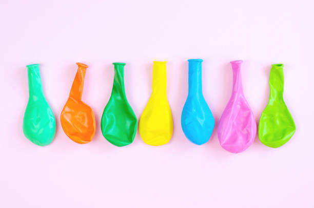 istock Many multicolored deflated balloons. 1158680831