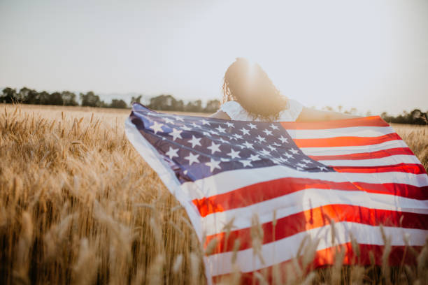 istock Young pretty woman walks in the cornfield while enjoying sunset 1158683775