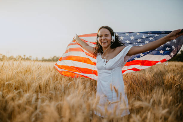 istock Young pretty woman walks in the cornfield while enjoying sunset 1158685055