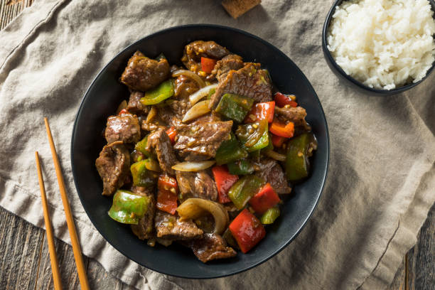 Homemade Chinese Pepper Steak Homemade Chinese Pepper Steak with White Rice stir fried stock pictures, royalty-free photos & images