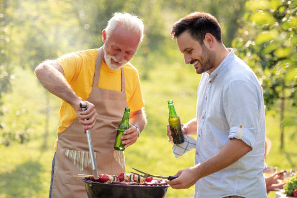 istock Family having barbecue in a park 1158686367