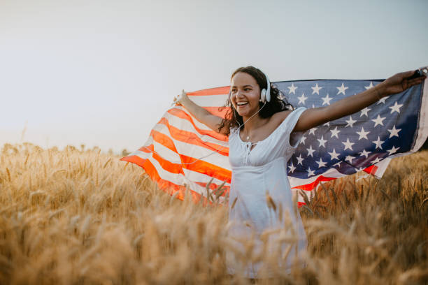 istock Young pretty woman walks in the cornfield while enjoying sunset 1158686472