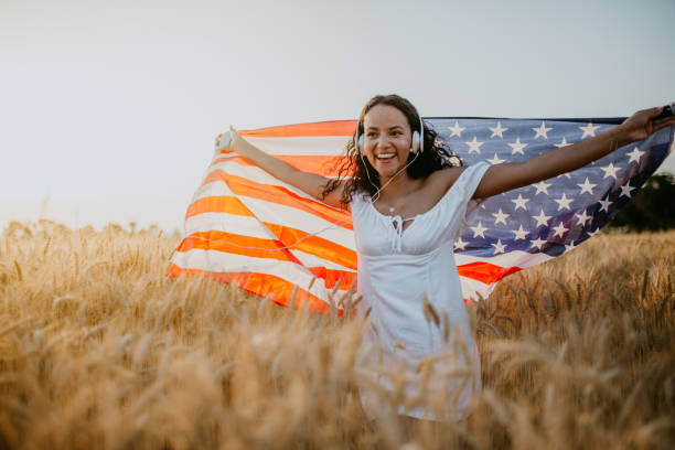 istock Young pretty woman walks in the cornfield while enjoying sunset 1158686492