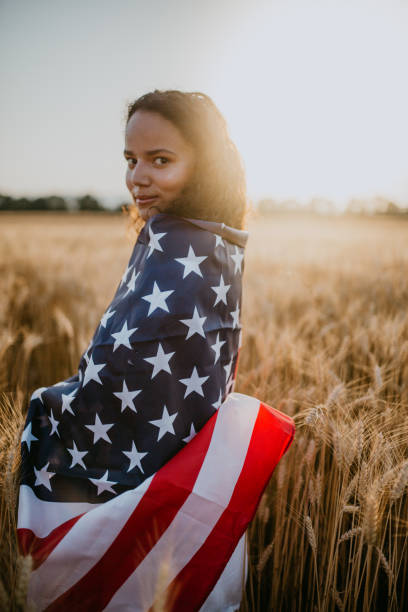 istock Young pretty woman walks in the cornfield while enjoying sunset 1158686527