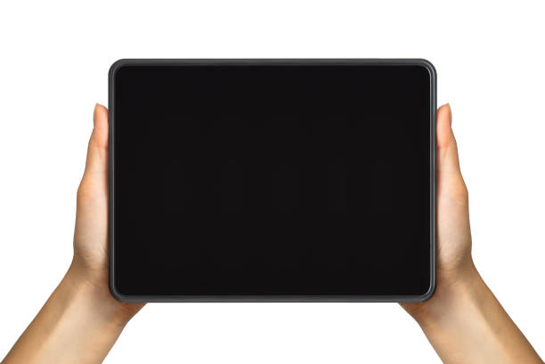 Women's hand showing black tablet, concept of taking photo or selfie Women's hand showing black tablet, concept of taking photo or playing games with two hands. Isolated with clipping path. tablet stock pictures, royalty-free photos & images