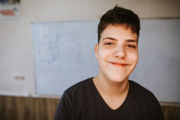 istock Young men in classroom smiling at camera 1158687612