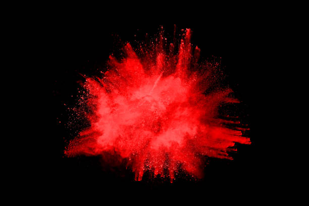 istock abstract red powder explosion on black background.abstract red powder splatted on black background. Freeze motion of red powder exploding. 1158688778