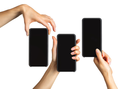 Set of women's hands showing black smartphone, concept of mobile shopping. Isolated with clipping path.