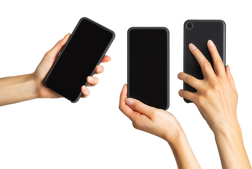 Set of women's hands showing black smartphone, concept of taking photo or selfie. Isolated with clipping path.