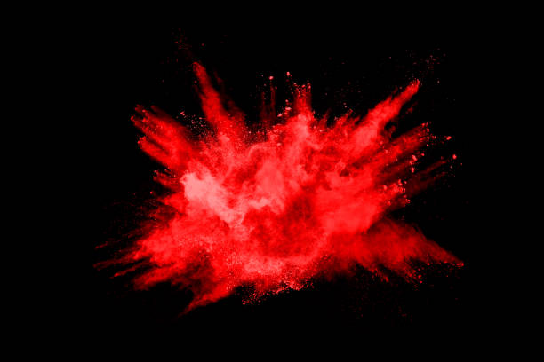 istock abstract red powder explosion on black background.abstract red powder splatted on black background. Freeze motion of red powder exploding. 1158688797
