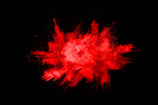 istock abstract red powder explosion on black background.abstract red powder splatted on black background. Freeze motion of red powder exploding. 1158688823