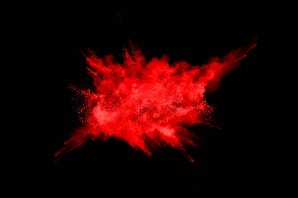 istock abstract red powder explosion on black background.abstract red powder splatted on black background. Freeze motion of red powder exploding. 1158688833