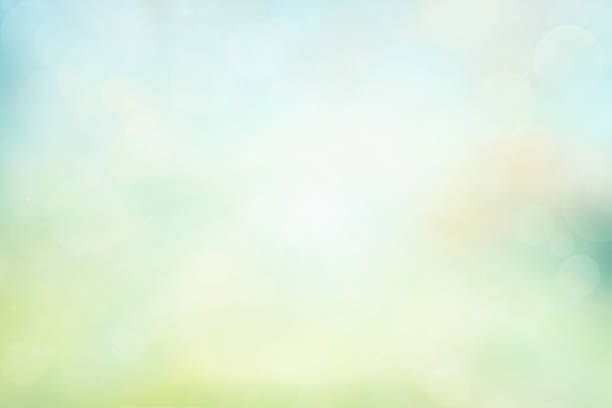 istock Spring or summer background. Green and yellow blurred abstract background with magic lights 1158691399