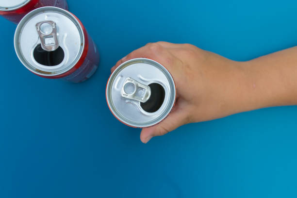 istock Hand holding an open aluminum can. 1158691501