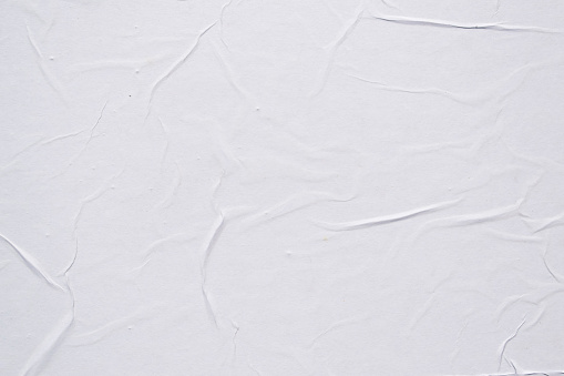 Textura de póster arrugada en blanco. Fondo abstracto. photo