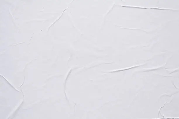 Photo of White creased poster texture. Abstract background.