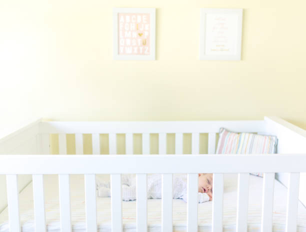 istock Sweet baby sleeping in a crib 1158692301