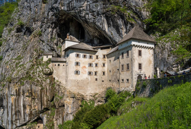 Predjama, Slovenia - 24 May 2019: Famous castle of Predjama built into a cave in mountain in Slovenia