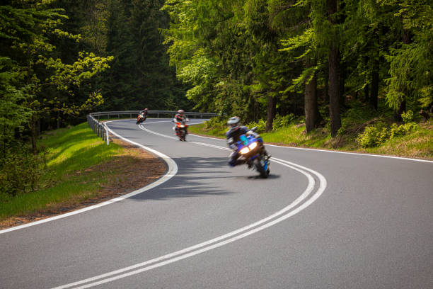 istock motorcyclist riding on the mountain road 1158695044