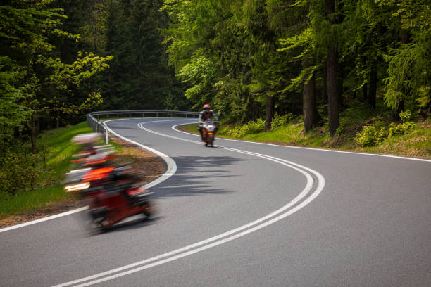 istock motorcyclist riding on the mountain road 1158695063