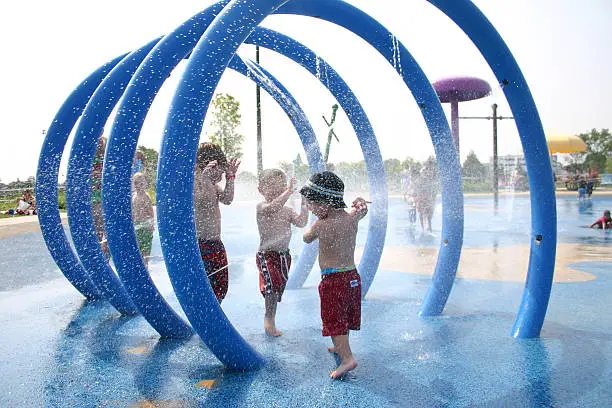 Kids playing in a water park.