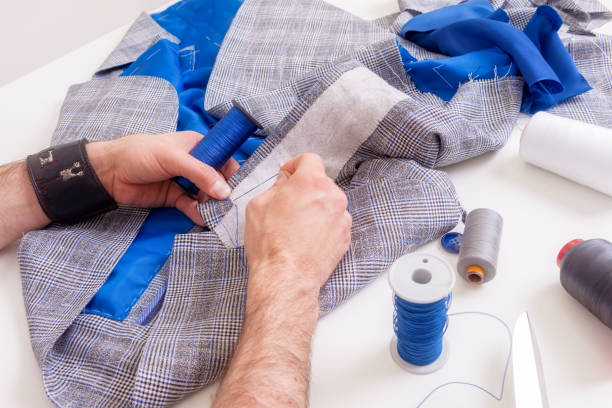istock Male tailor hands during suit manufacturing 1158699019