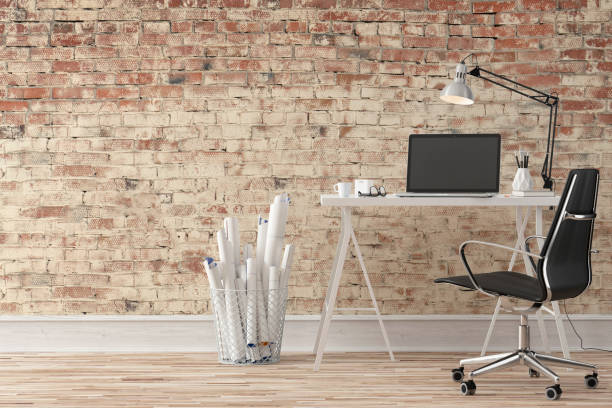 istock Workdesk with decoration and copy space - brick wall 1158700069
