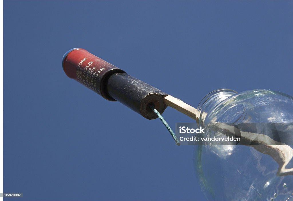 Countdown to launch! Traditional "rocket in a milkbottle" ready to launch under a clear blue sky. Waiting ... waiting for nightfall ... don't worry, kids, only another nine hours. Oh, stop your whining! Firework - Explosive Material Stock Photo