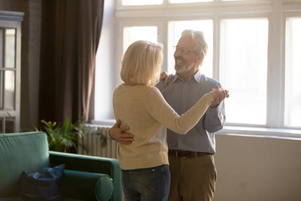 istock Active elderly wife and husband dancing at home 1158702085