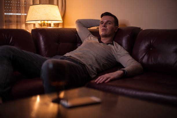 istock Enjoying lazy afternoon on a couch 1158703683