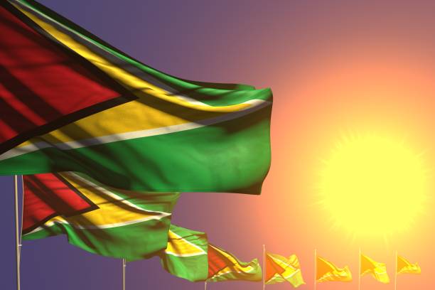 istock cute many Guyana flags placed diagonal on sunset with place for your content - any feast flag 3d illustration 1158706840