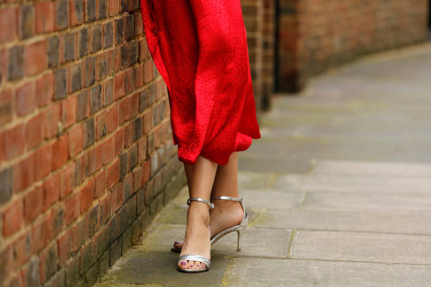 istock Woman walking in silver color high heels 1158708086