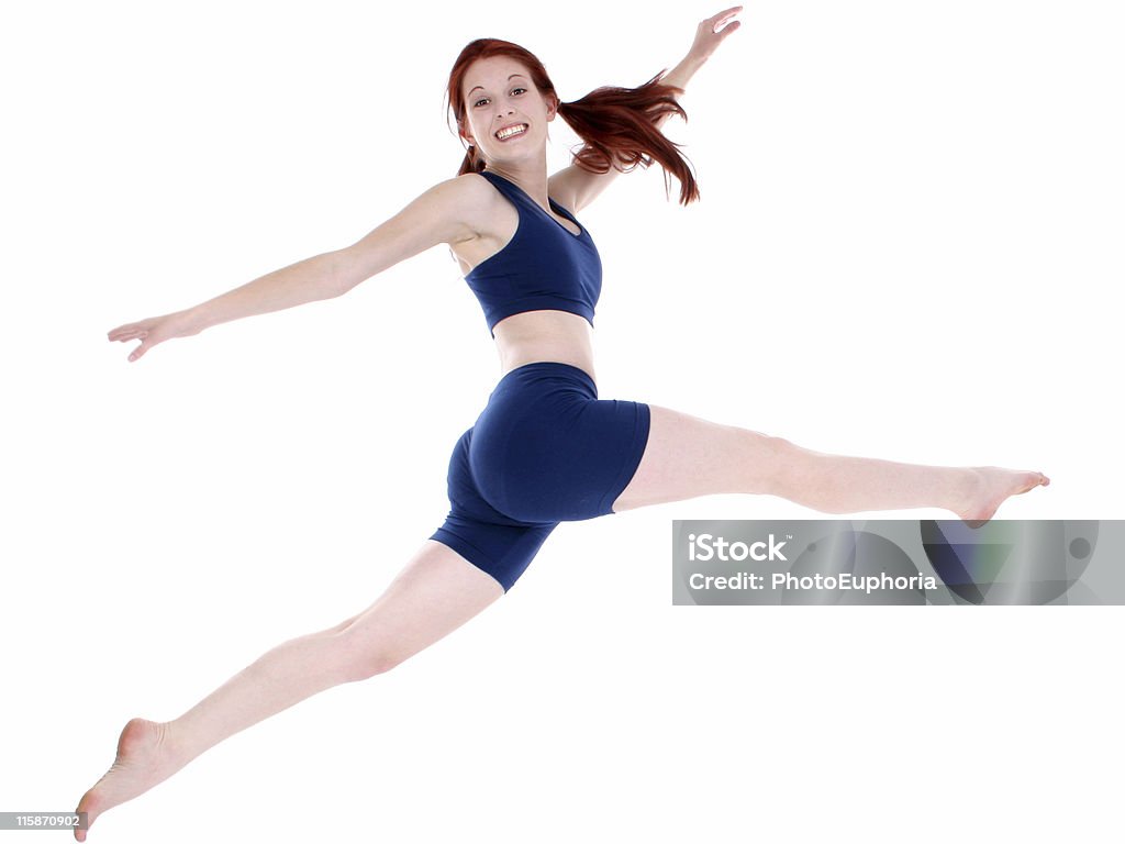 Beautiful Teenage Girl in Workout Clothes Leaping  16-17 Years Stock Photo