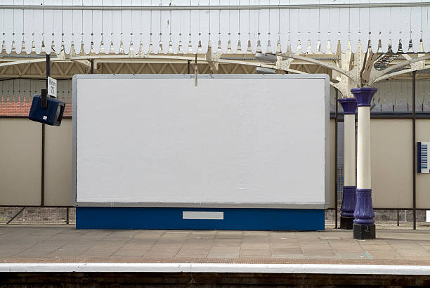 Blank british billboard at a railway station A blank british billboard ready for your campaign mock ups railroad station platform photos stock pictures, royalty-free photos & images