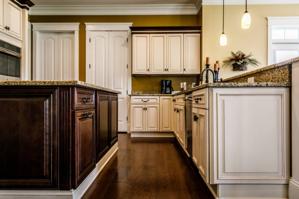 istock Modern kitchen with the two toned to cabinets and hardwood floor 1158713210