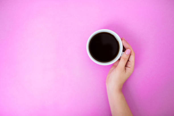 istock Flatlay with woman holding coffee mug with one hand. 1158713367