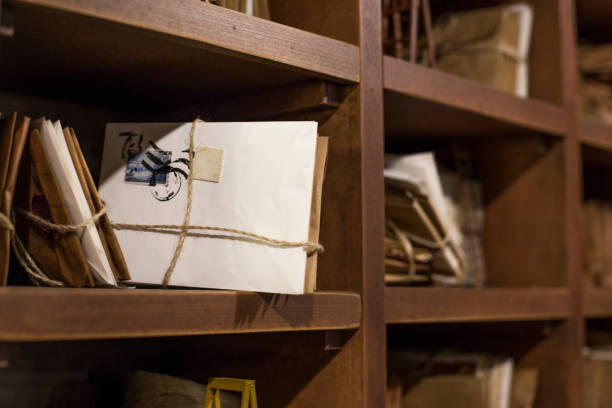 istock Stack of old letters on a wooden bookcase. Old mail of the post office 1158713566